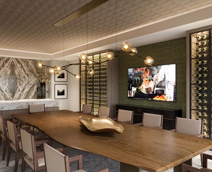 Modern conference room with a large wooden table, elegant lighting, wine display, and wall art featuring a cooking scene on a screen.