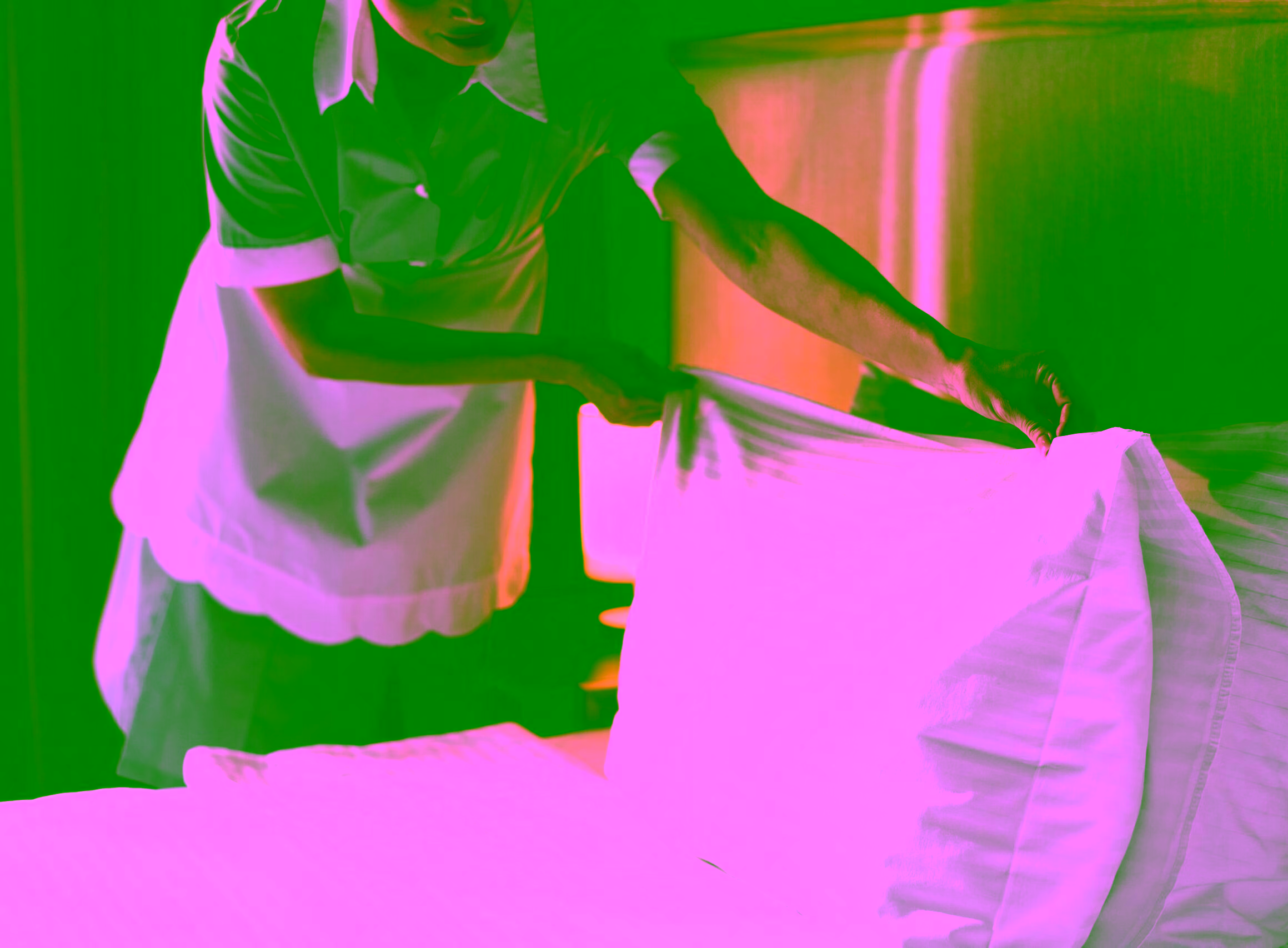 housemaid changing some pillow sheets